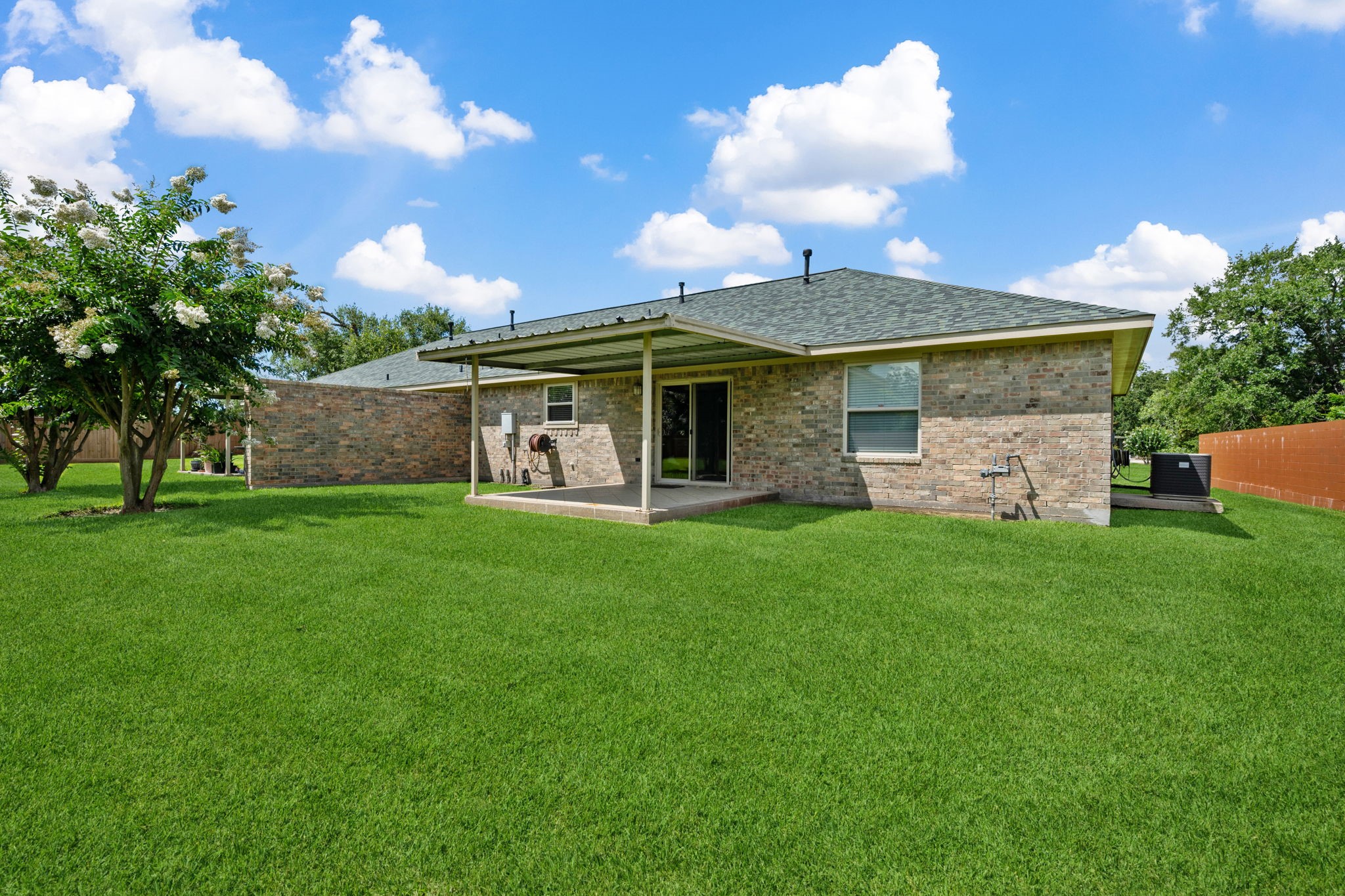 460 West Houston Street Highlands, TX 77562 - Photo 13 of 14 a view of a house with a yard