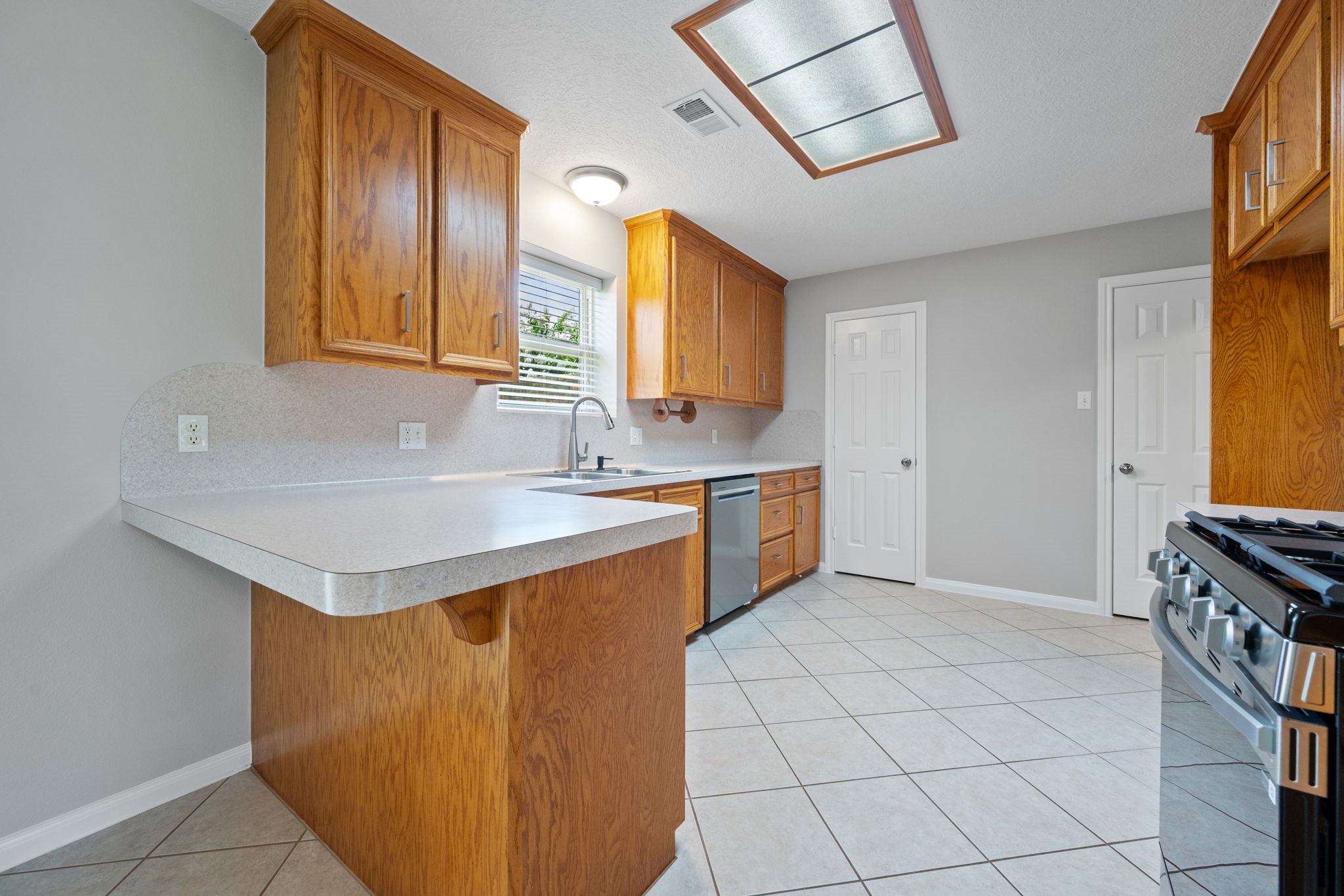 460 West Houston Street Highlands, TX 77562 - Photo 6 of 14 a bathroom with a sink vanity and a mirror
