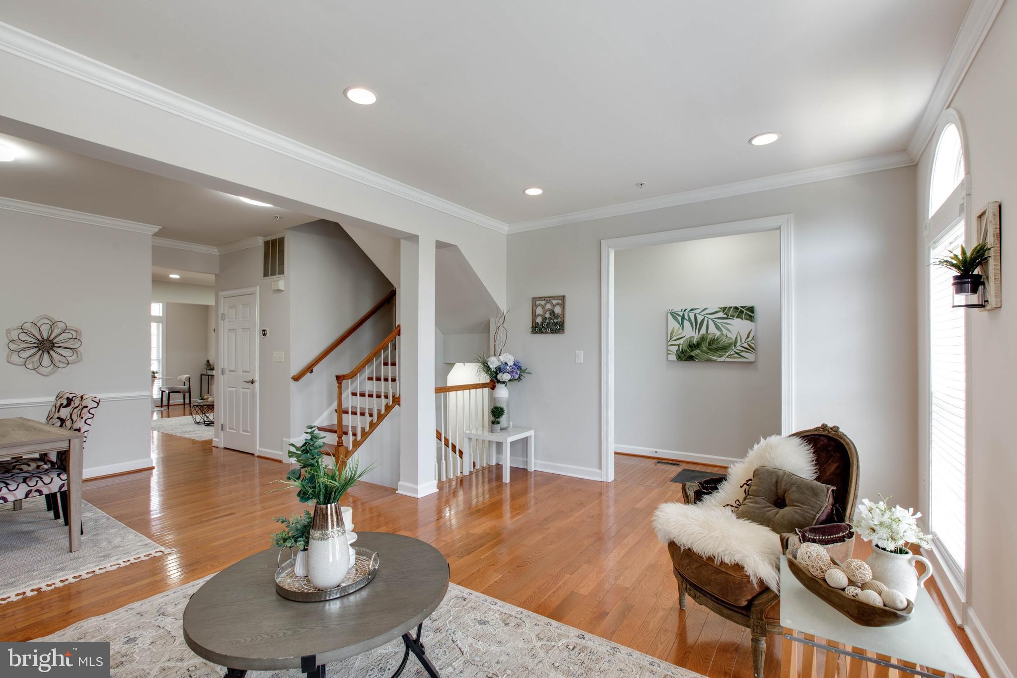 1506 Penzance Way Hanover, MD 21076 - Photo 11 of 53 a living room with furniture and wooden floor