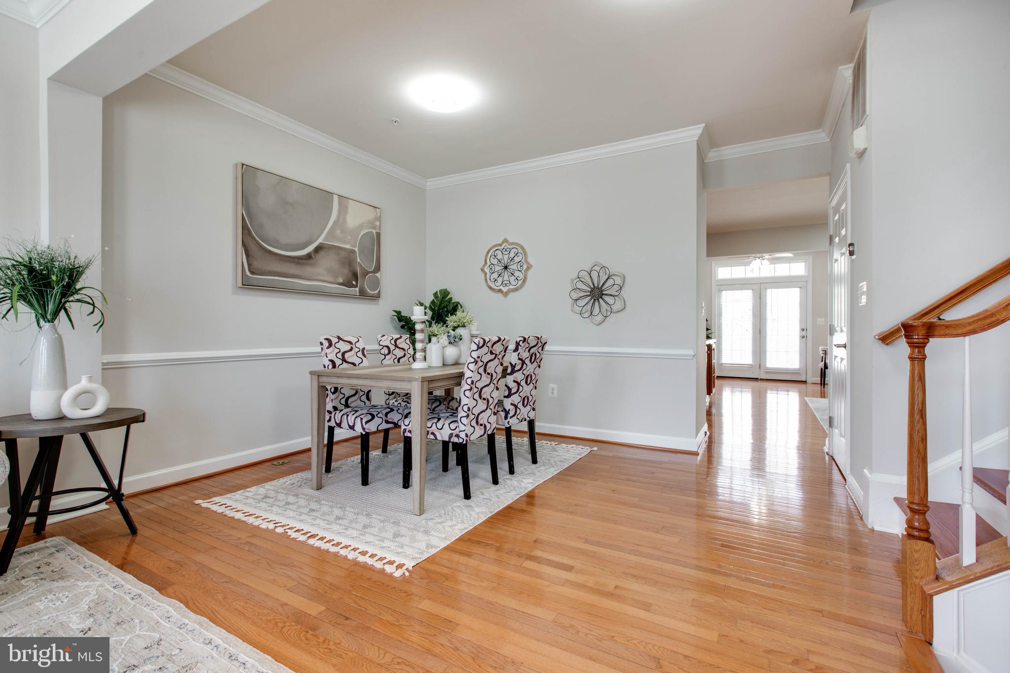 1506 Penzance Way Hanover, MD 21076 - Photo 12 of 53 a view of a dining room with furniture and wooden floor