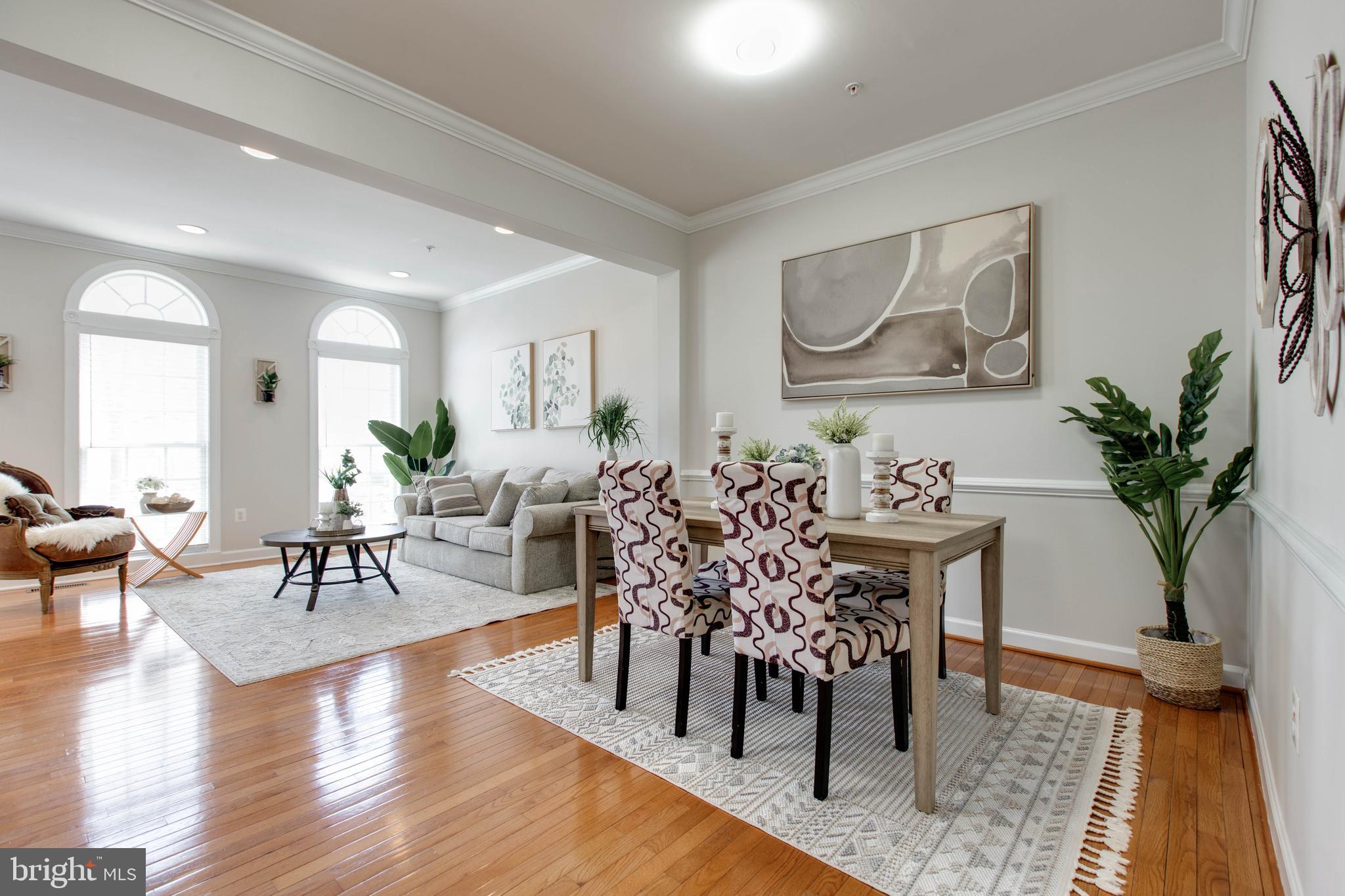 1506 Penzance Way Hanover, MD 21076 - Photo 14 of 53 a view of a dining room with furniture window and wooden floor