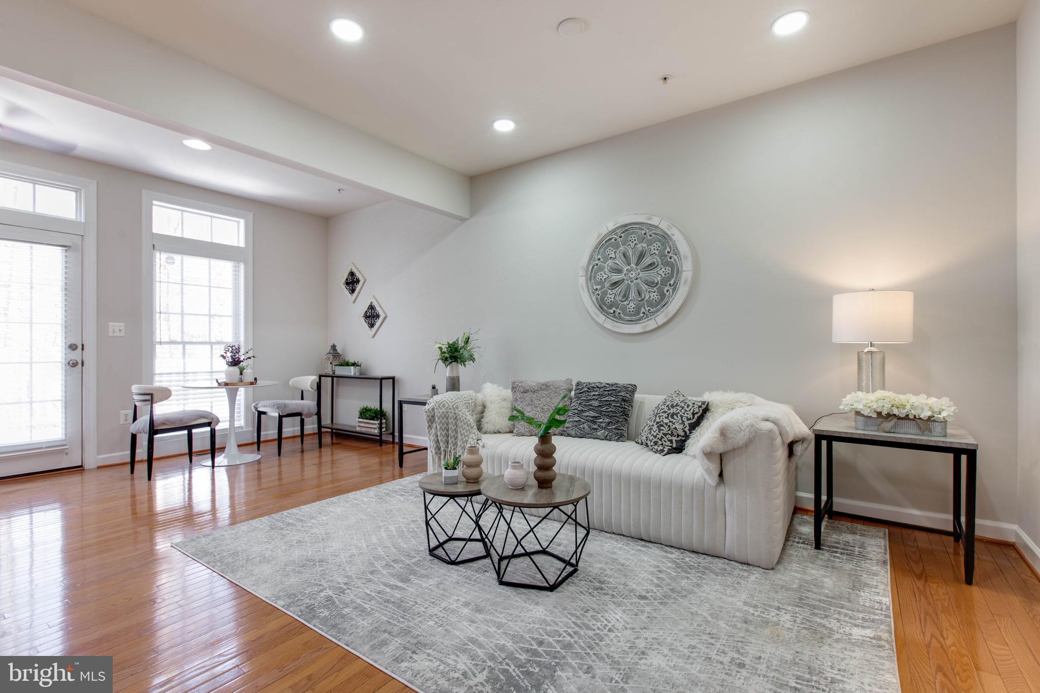 1506 Penzance Way Hanover, MD 21076 - Photo 16 of 53 a living room with furniture and wooden floor