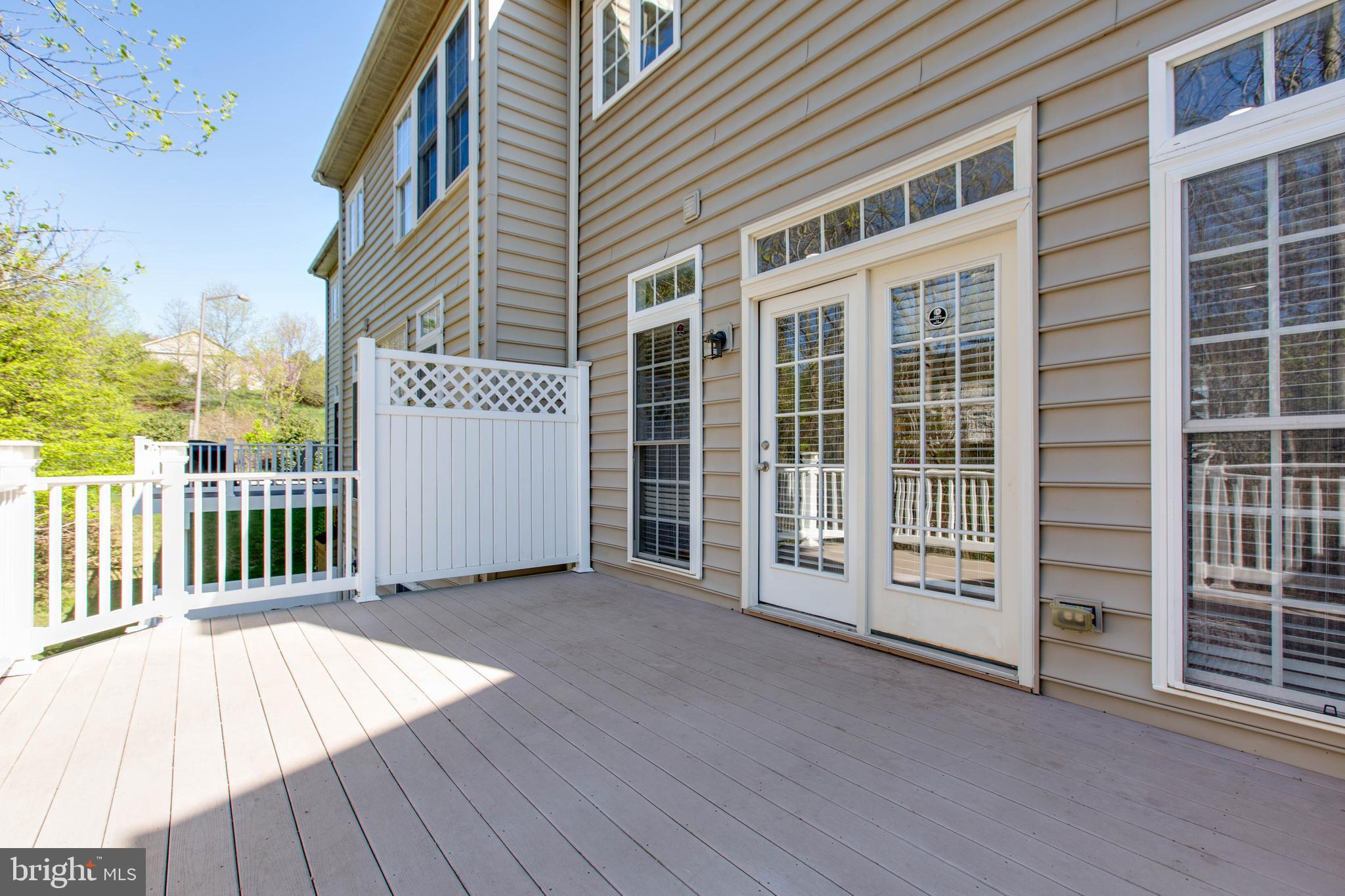 1506 Penzance Way Hanover, MD 21076 - Photo 26 of 53 a view of a balcony with a barbeque grill with wooden fence