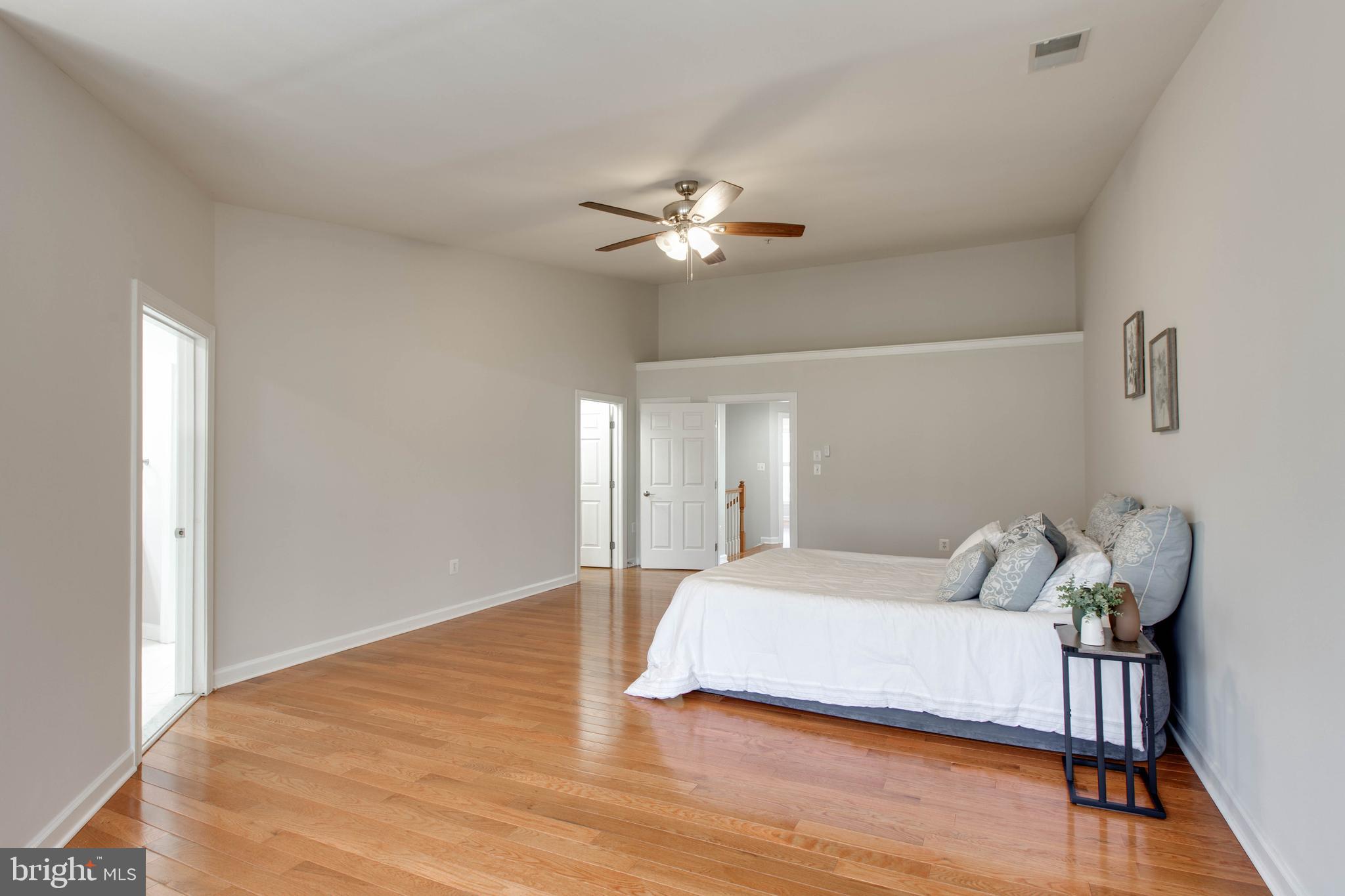 1506 Penzance Way Hanover, MD 21076 - Photo 30 of 53 a bedroom with a bed and a ceiling fan