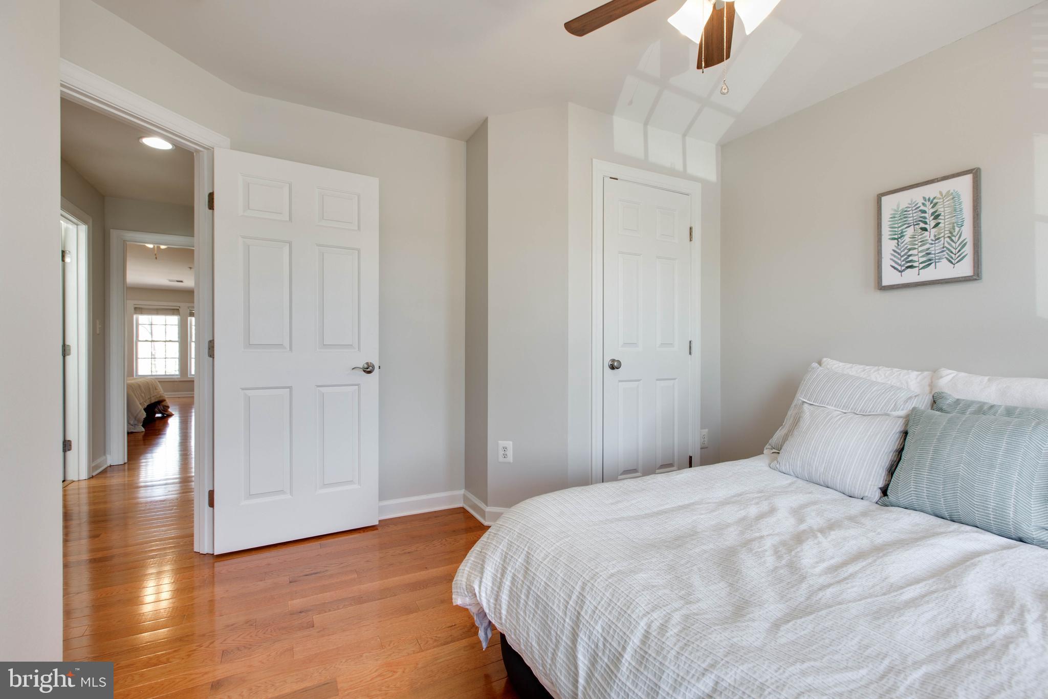 1506 Penzance Way Hanover, MD 21076 - Photo 36 of 53 a bedroom with a bed and a chandelier