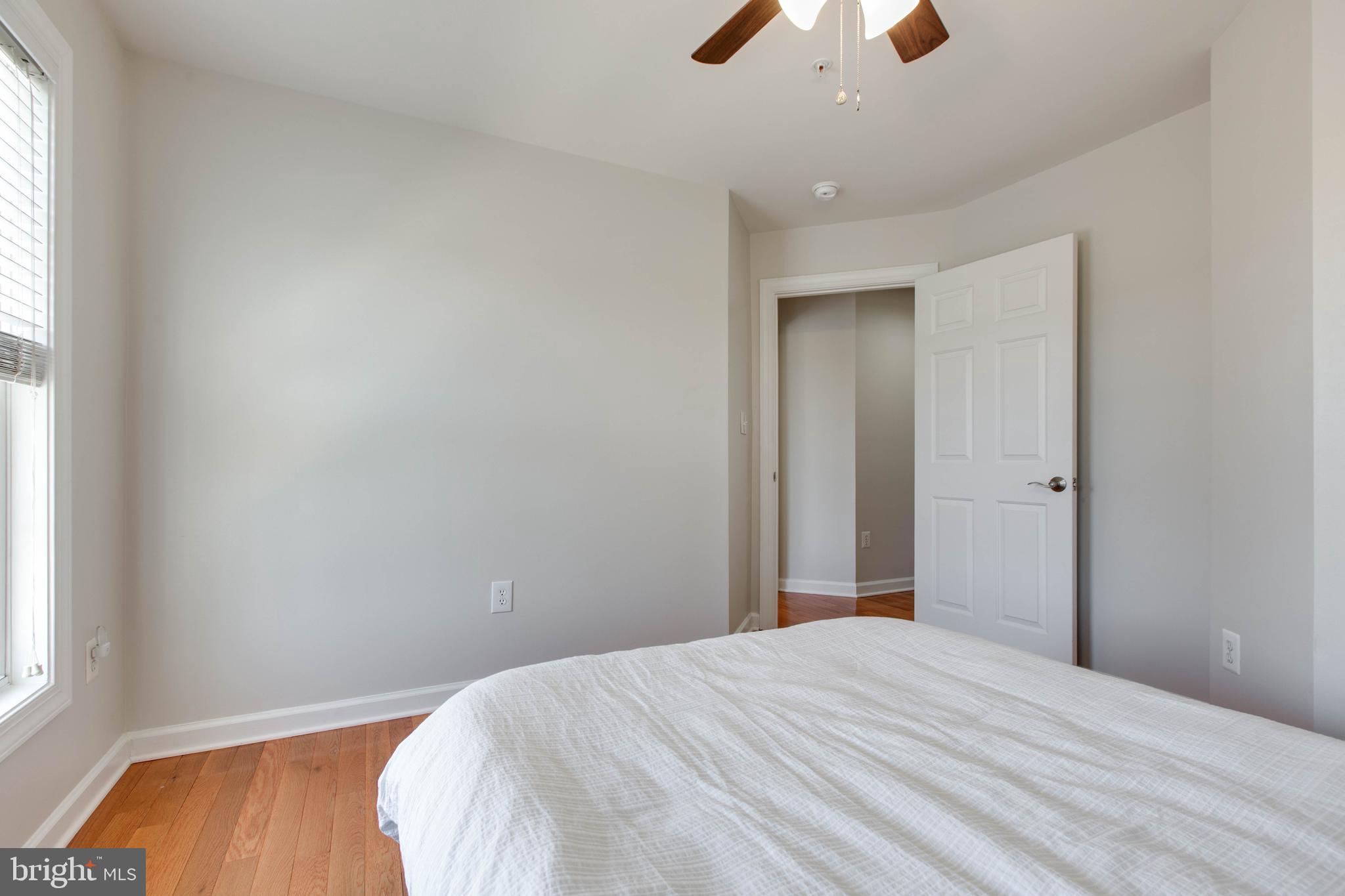 1506 Penzance Way Hanover, MD 21076 - Photo 37 of 53 a bedroom with a bed and a chandelier