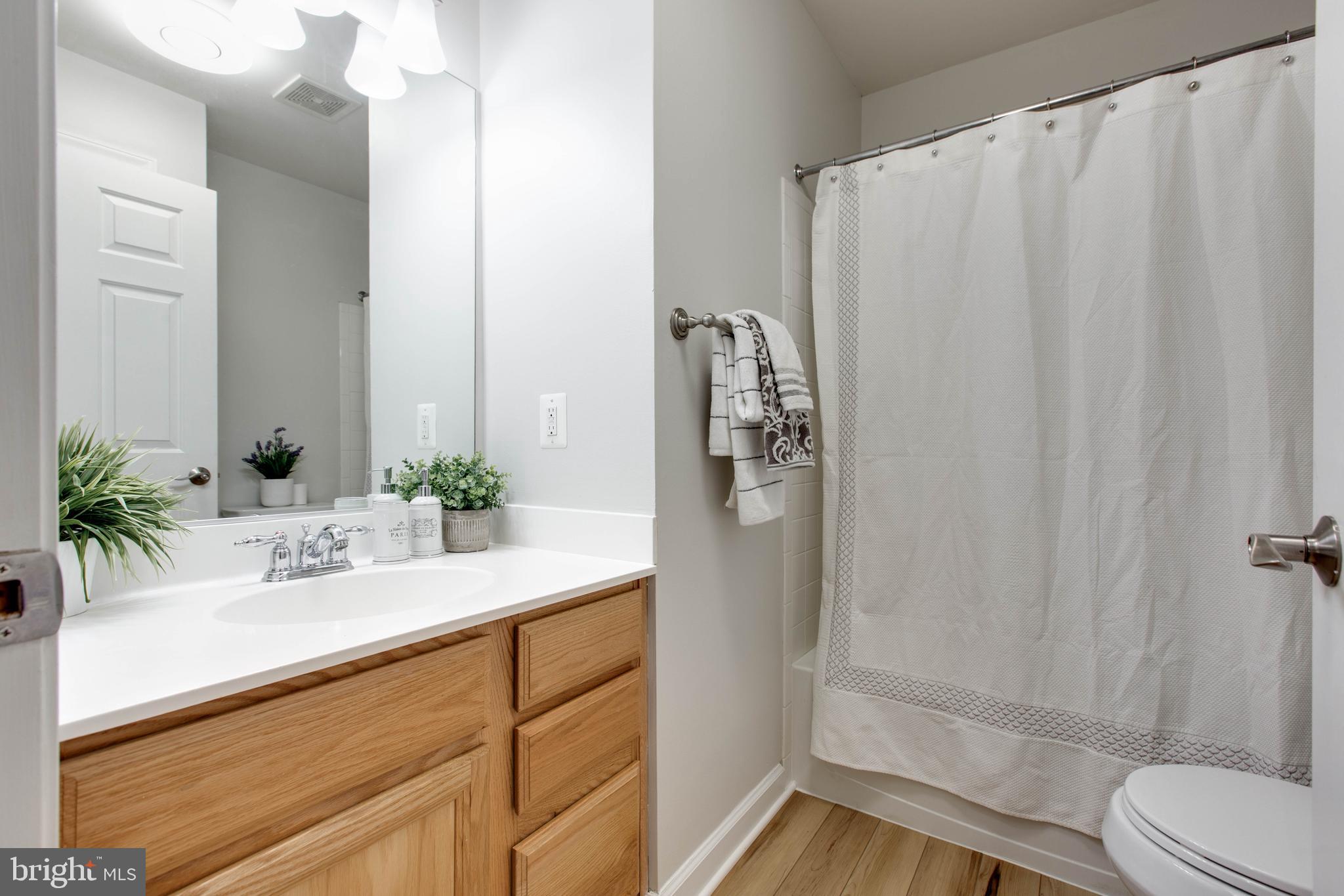 1506 Penzance Way Hanover, MD 21076 - Photo 38 of 53 a bathroom with a sink and a mirror