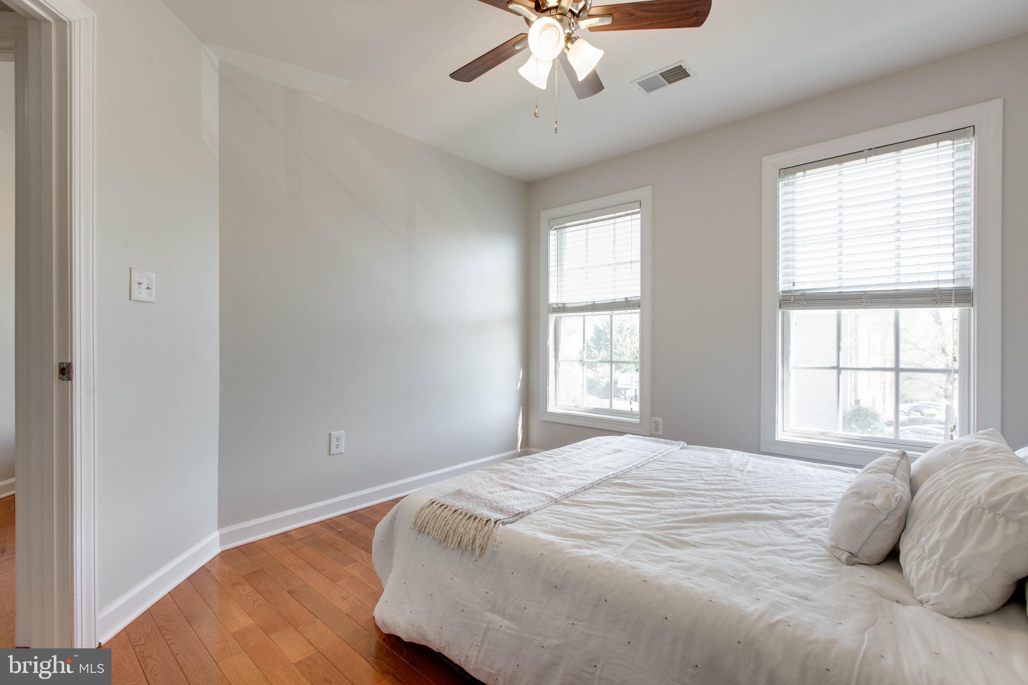 1506 Penzance Way Hanover, MD 21076 - Photo 40 of 53 a bedroom with a large bed and a window