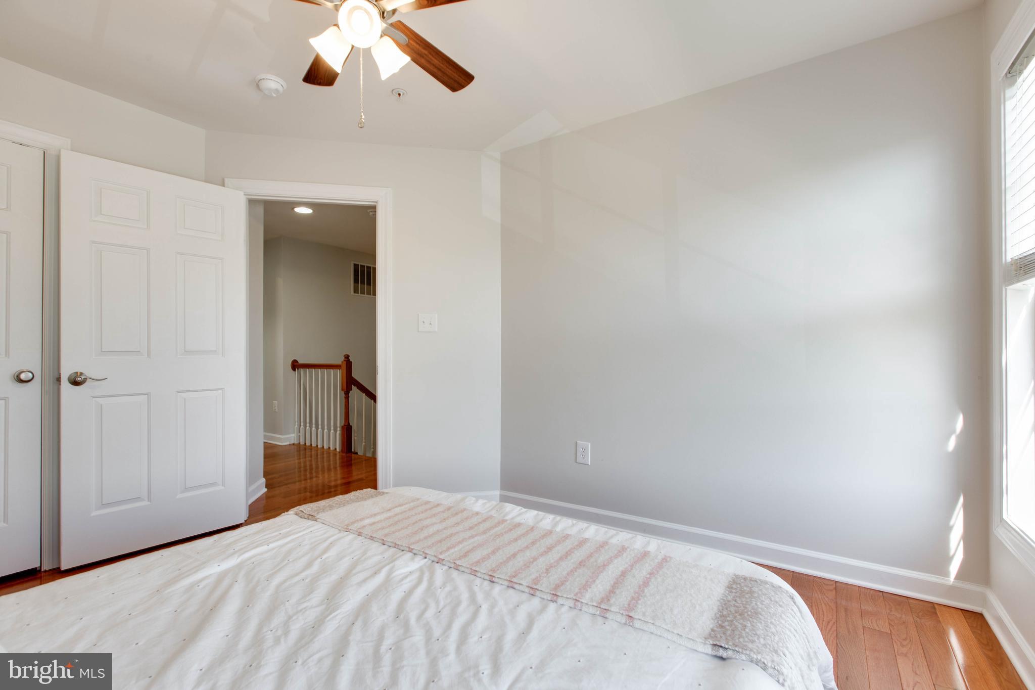 1506 Penzance Way Hanover, MD 21076 - Photo 42 of 53 a bedroom with a bed and a chandelier