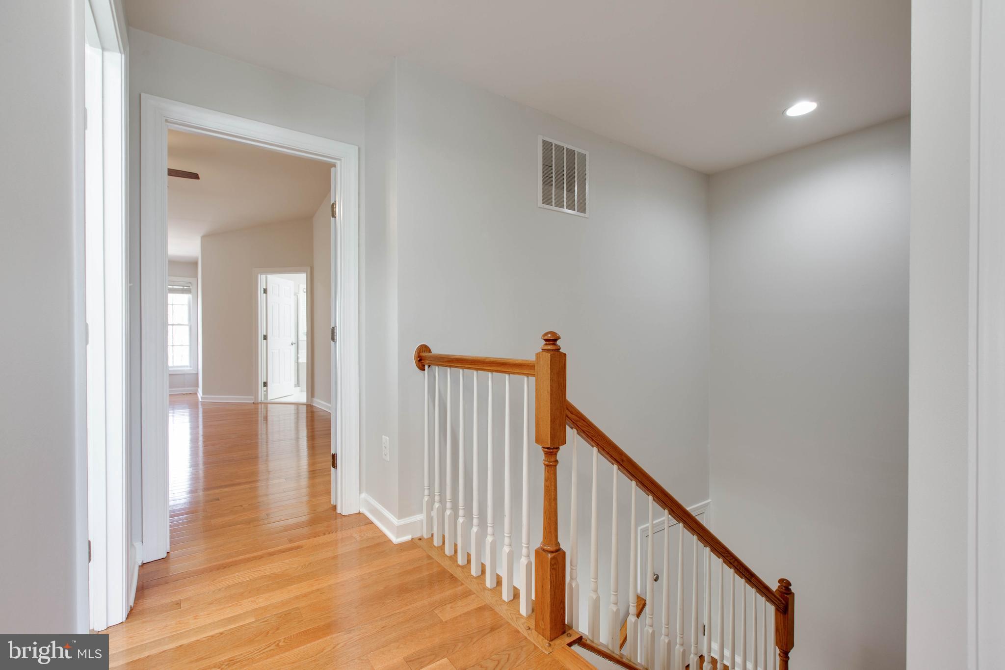 1506 Penzance Way Hanover, MD 21076 - Photo 43 of 53 a view of a hallway with wooden floor and entryway