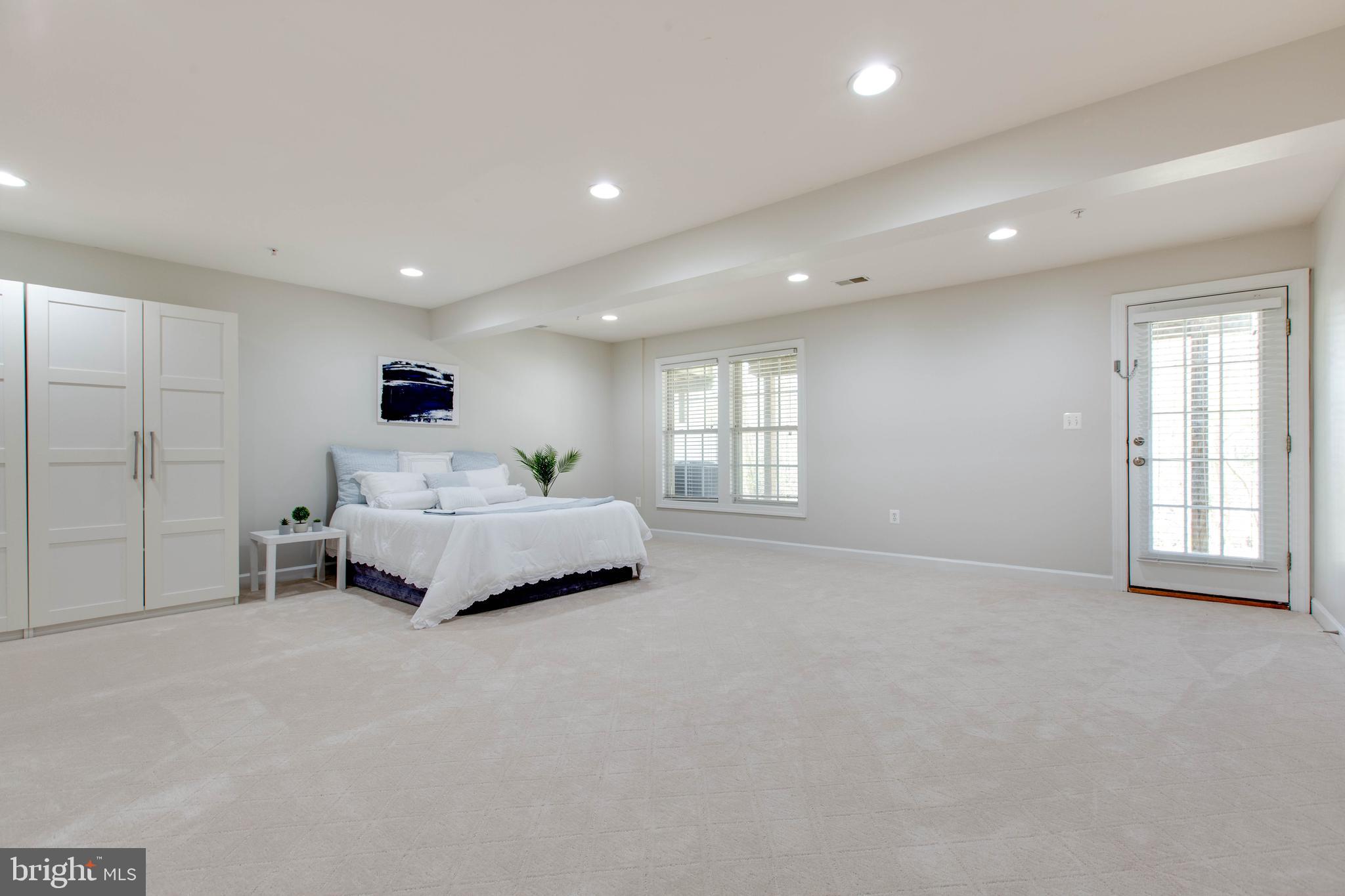 1506 Penzance Way Hanover, MD 21076 - Photo 44 of 53 a spacious bedroom with a bed and a window