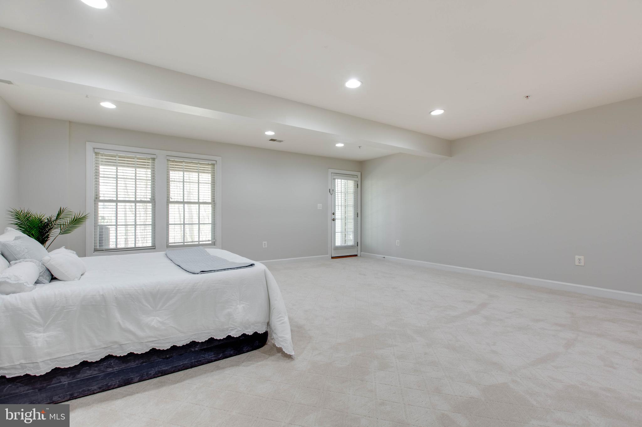 1506 Penzance Way Hanover, MD 21076 - Photo 45 of 53 a spacious bedroom with a bed and a window