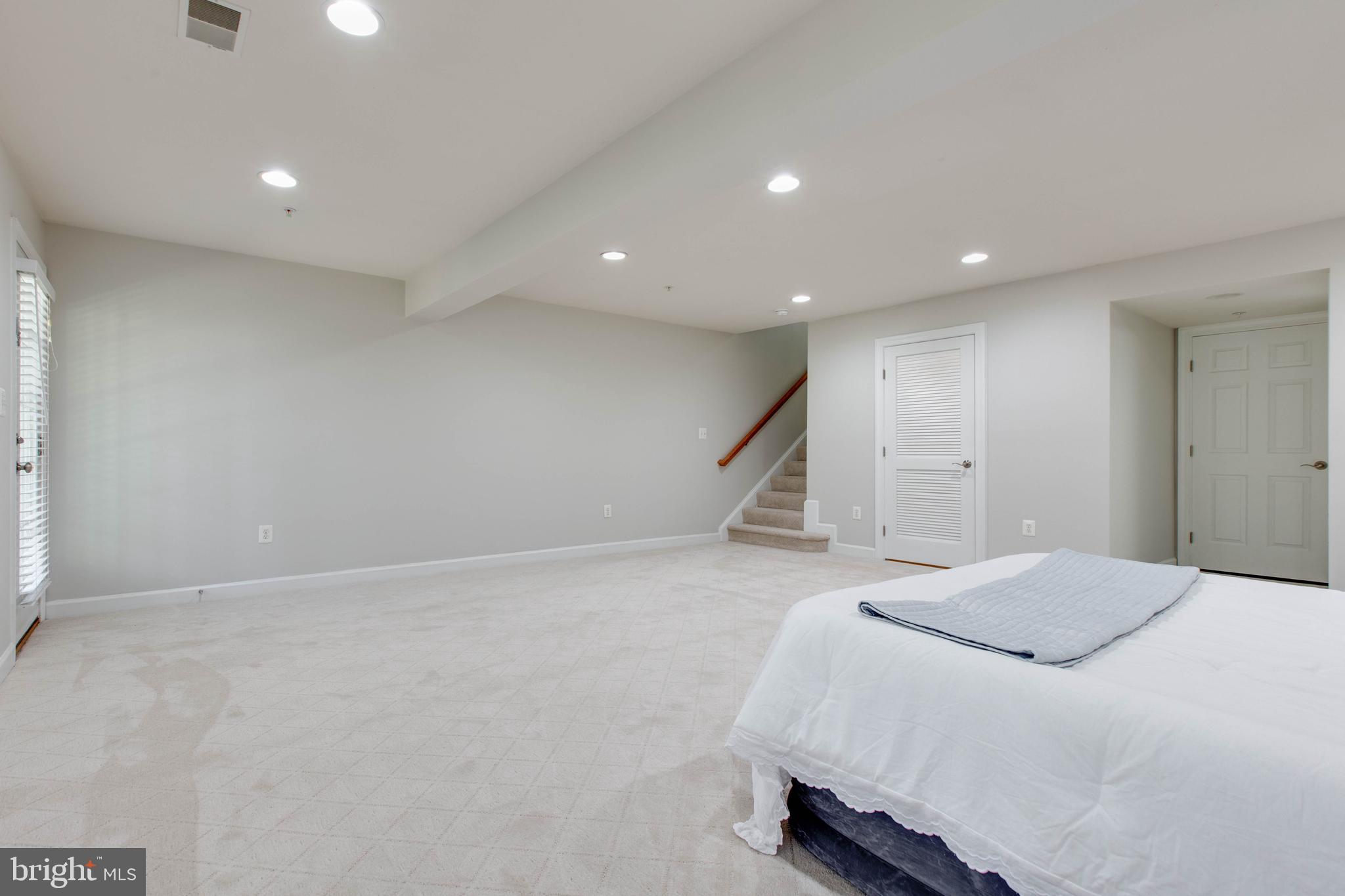 1506 Penzance Way Hanover, MD 21076 - Photo 47 of 53 a spacious bedroom with a bed and a large window