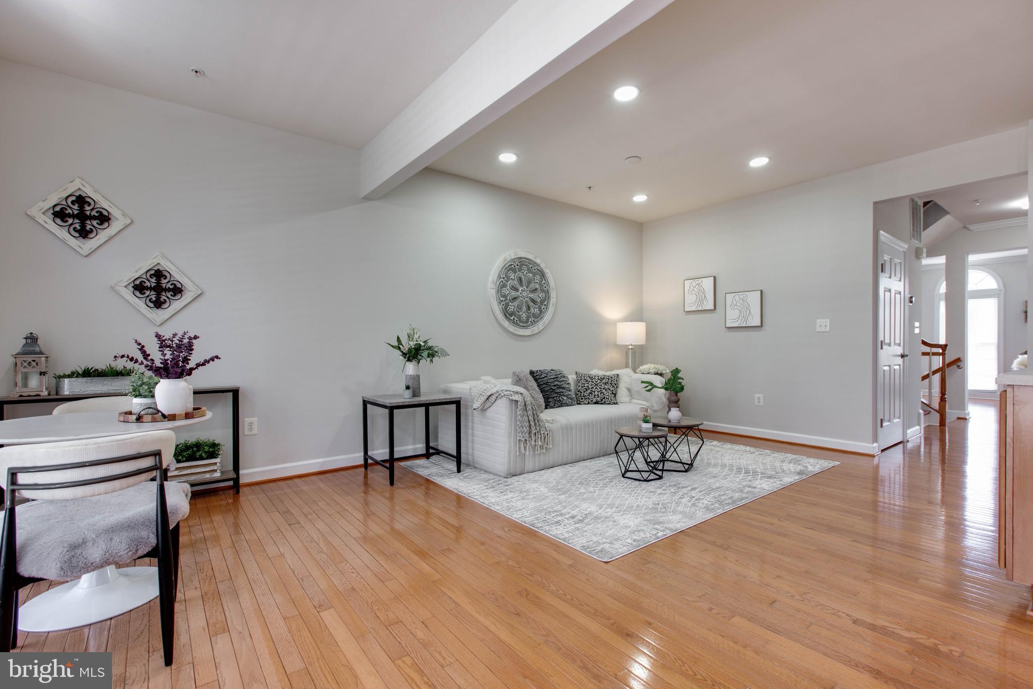 1506 Penzance Way Hanover, MD 21076 - Photo 6 of 53 a living room with furniture and wooden floor