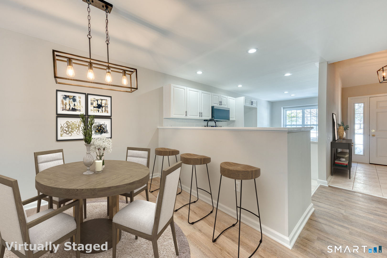 159 Jennifer Lane, Unit 159 Newtown, CT 06482 - Photo 8 of 28 a kitchen with stainless steel appliances granite countertop a dining table chairs and a refrigerator