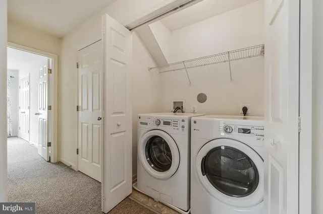 a view of a storage & utility room with washer and dryer