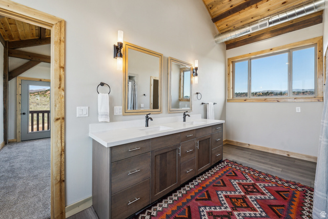 46997 West Thunder Road Fruitland, UT 84027 - Photo 27 of 49 Full bath featuring vaulted ceiling, double vanity, and wooden ceiling