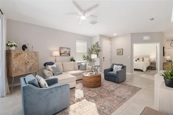 a open dining room with stainless steel appliances kitchen island a table chairs and chandelier