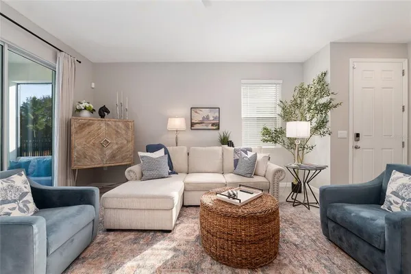 a view of a dining room with furniture wooden floor and a chandelier