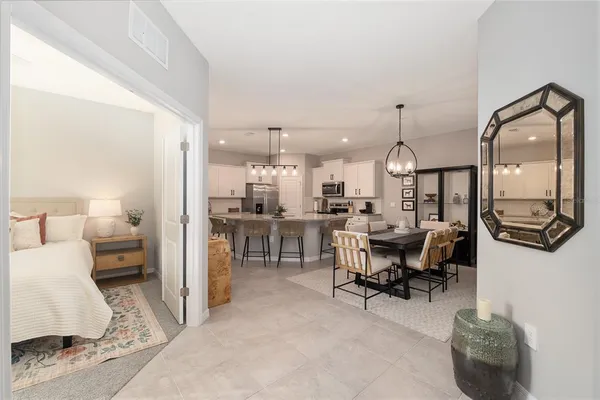 a kitchen with granite countertop a stove microwave and refrigerator