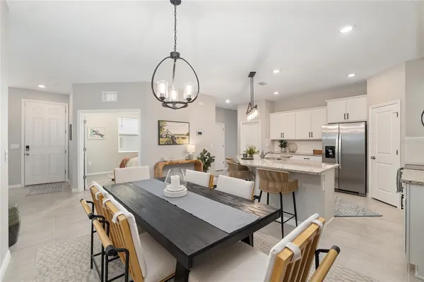 a spacious bedroom with a bed and a window