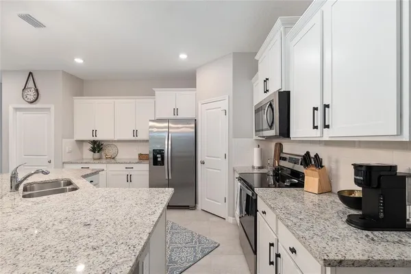 a bedroom with a bed and a flat screen television