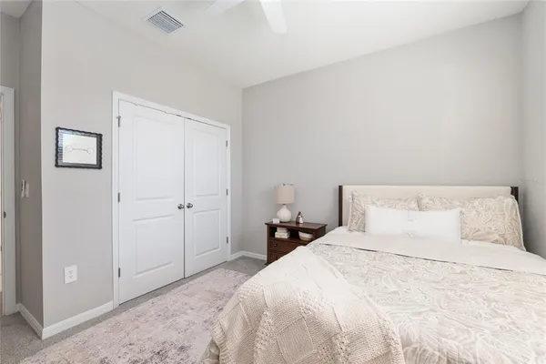 a view of a swimming pool with an outdoor seating and a lake view