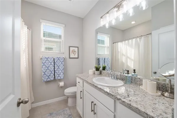 a view of a chairs and table in a patio