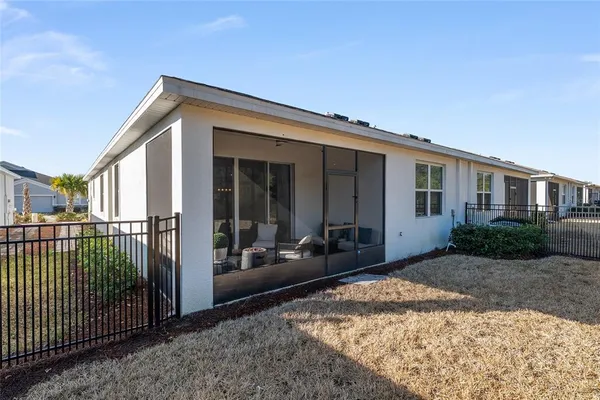 an aerial view of a houses with outdoor space
