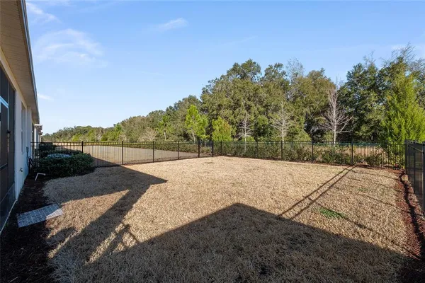 a view of swimming pool with a garden and seating area
