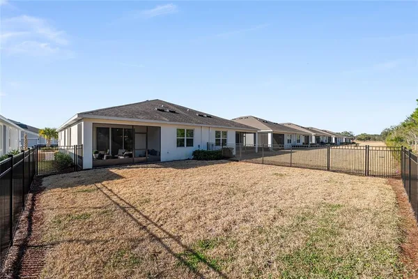 a view of a swimming pool with a yard