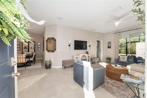 a living room with furniture and a large window