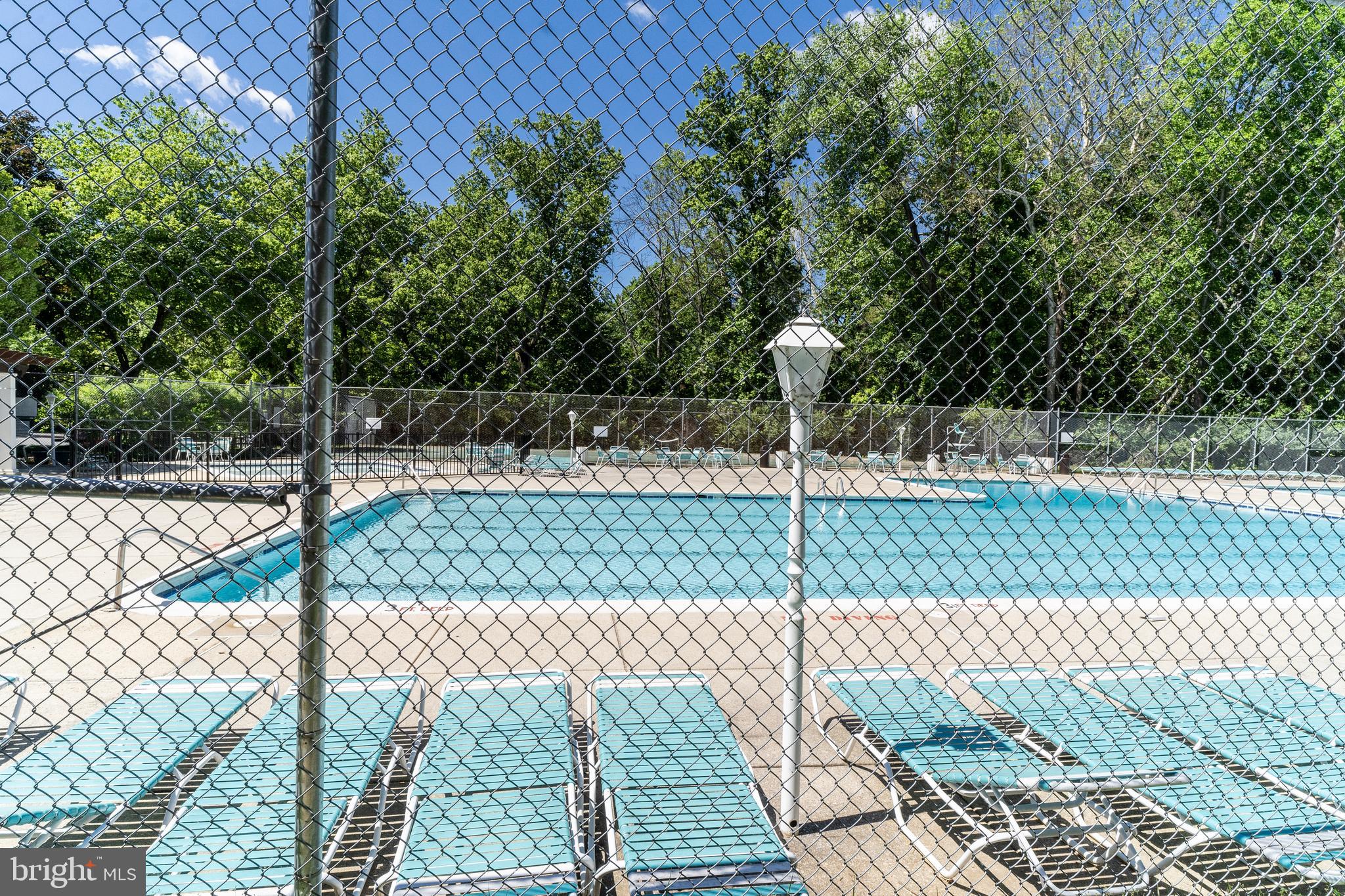 10500 Montrose Avenue, Unit M4 Rockville, MD 20852 - Photo 16 of 17 a street view with a fence