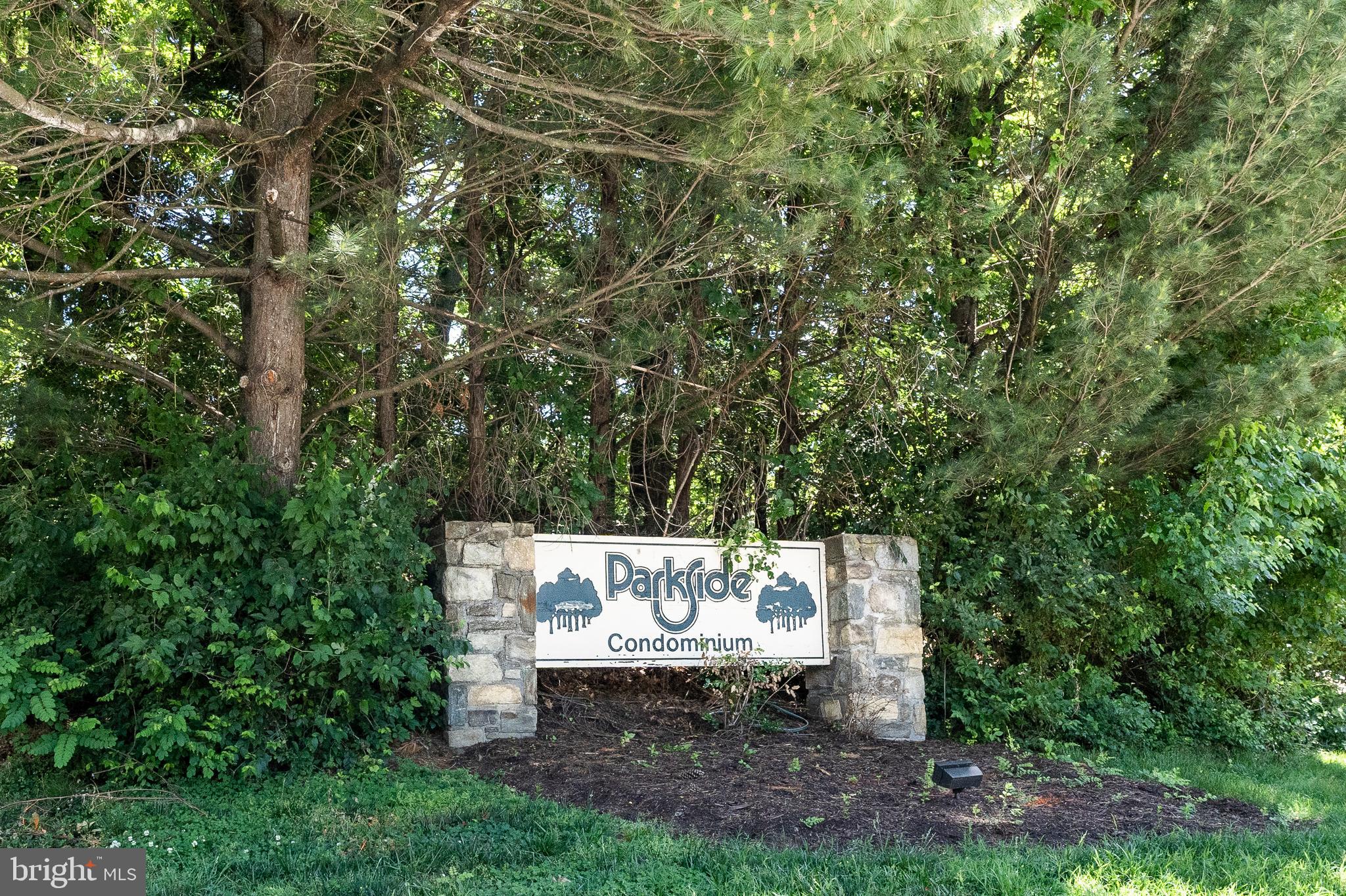 10500 Montrose Avenue, Unit M4 Rockville, MD 20852 - Photo 17 of 17 a view of a table and chairs in the garden