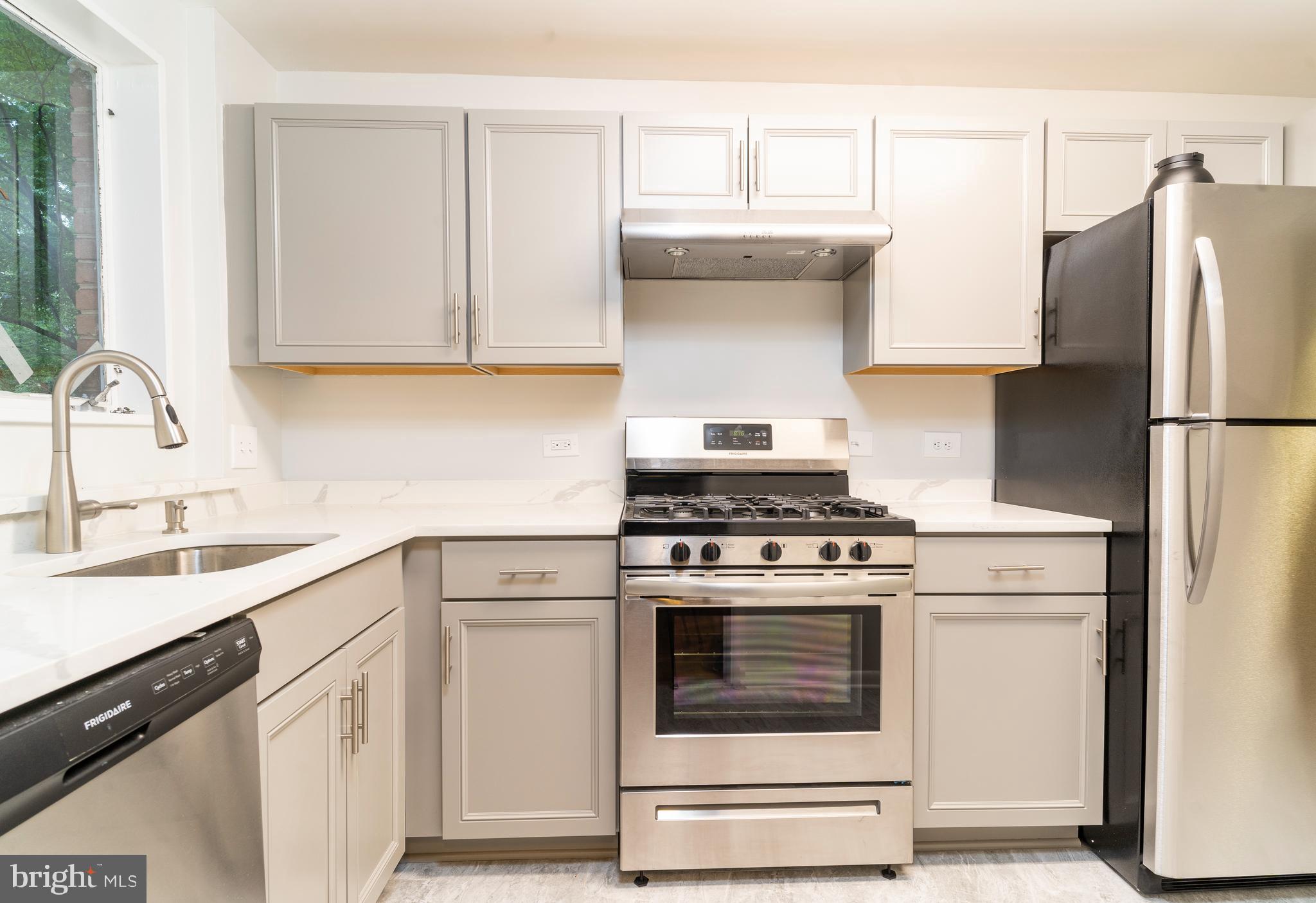 10500 Montrose Avenue, Unit M4 Rockville, MD 20852 - Photo 2 of 17 a kitchen with cabinets appliances and a sink