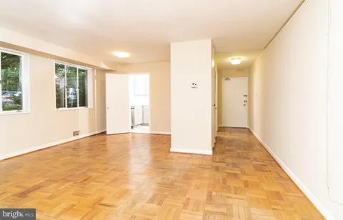 a view of an empty room with windows