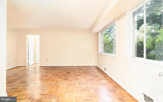 an empty room with windows