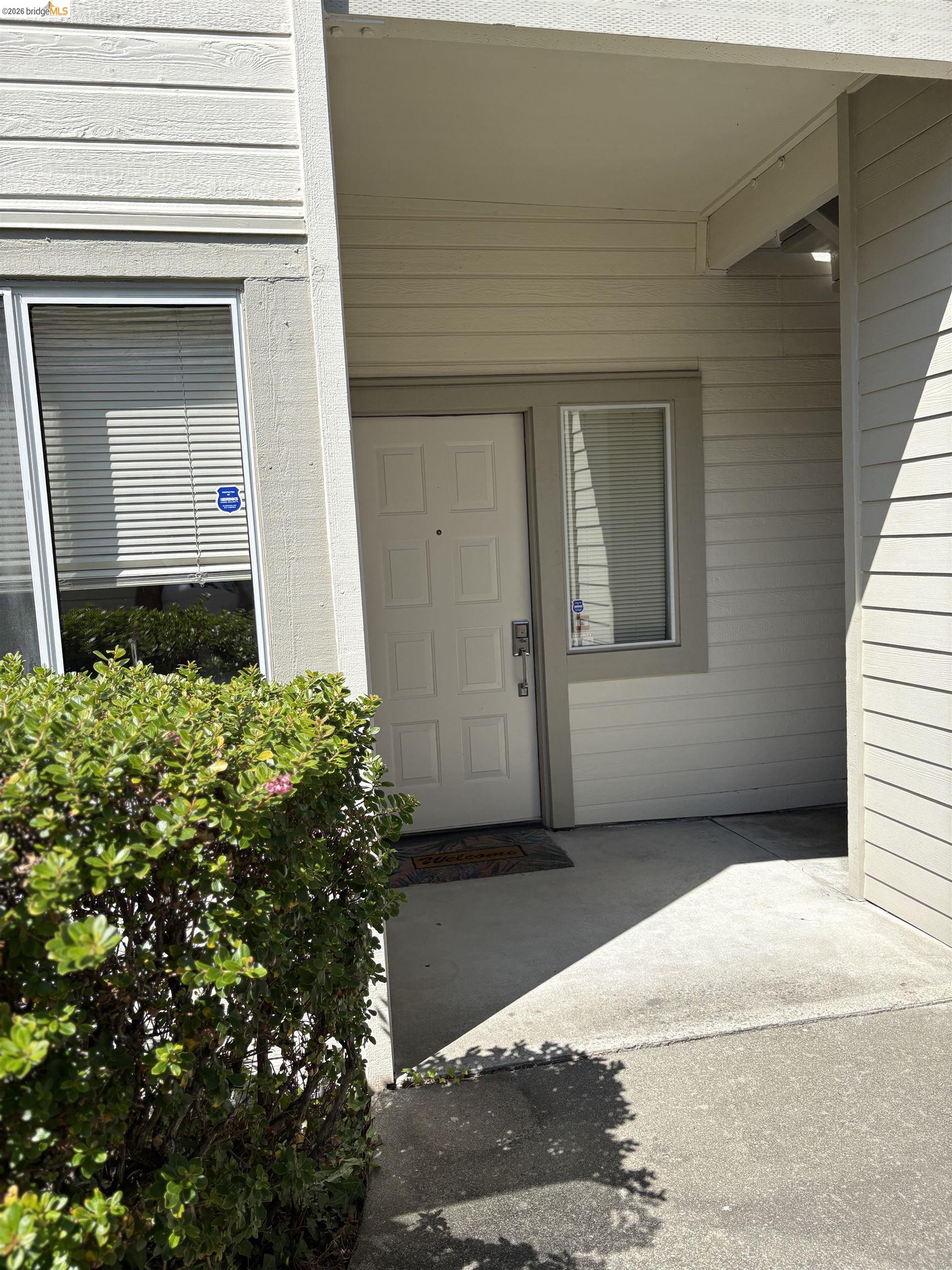 256 Napoli Court Hercules, CA 94547 - Photo 2 of 14 a front view of a house with a yard