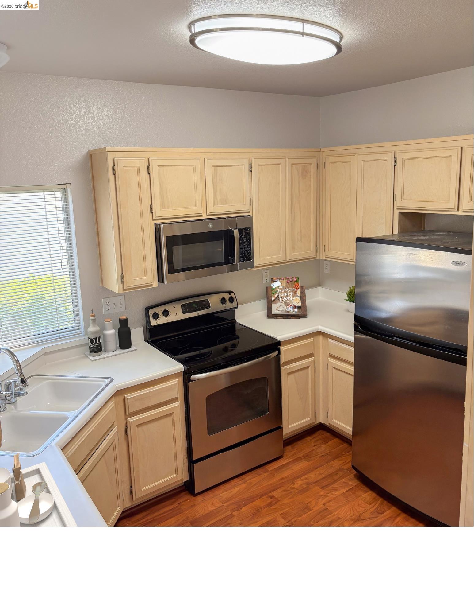 256 Napoli Court Hercules, CA 94547 - Photo 8 of 14 a kitchen with a sink appliances and cabinets