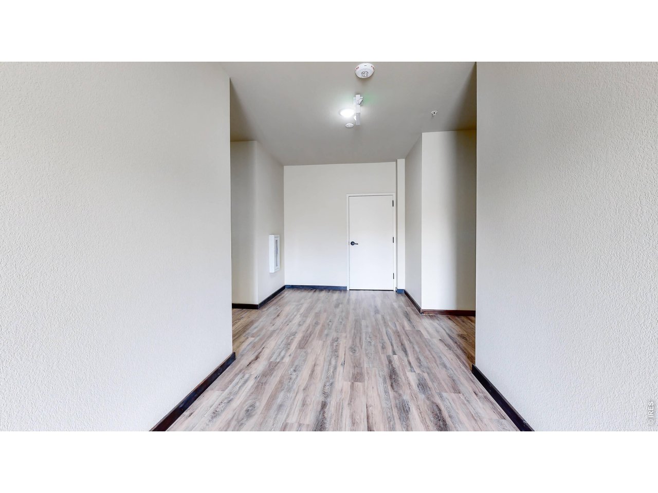 1734 Wildfire Road, Unit 204 Estes Park, CO 80517 - Photo 11 of 31 a open hall with wooden floor