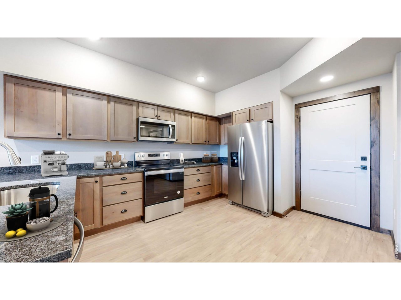1734 Wildfire Road, Unit 204 Estes Park, CO 80517 - Photo 13 of 31 a kitchen with appliances cabinets and a sink