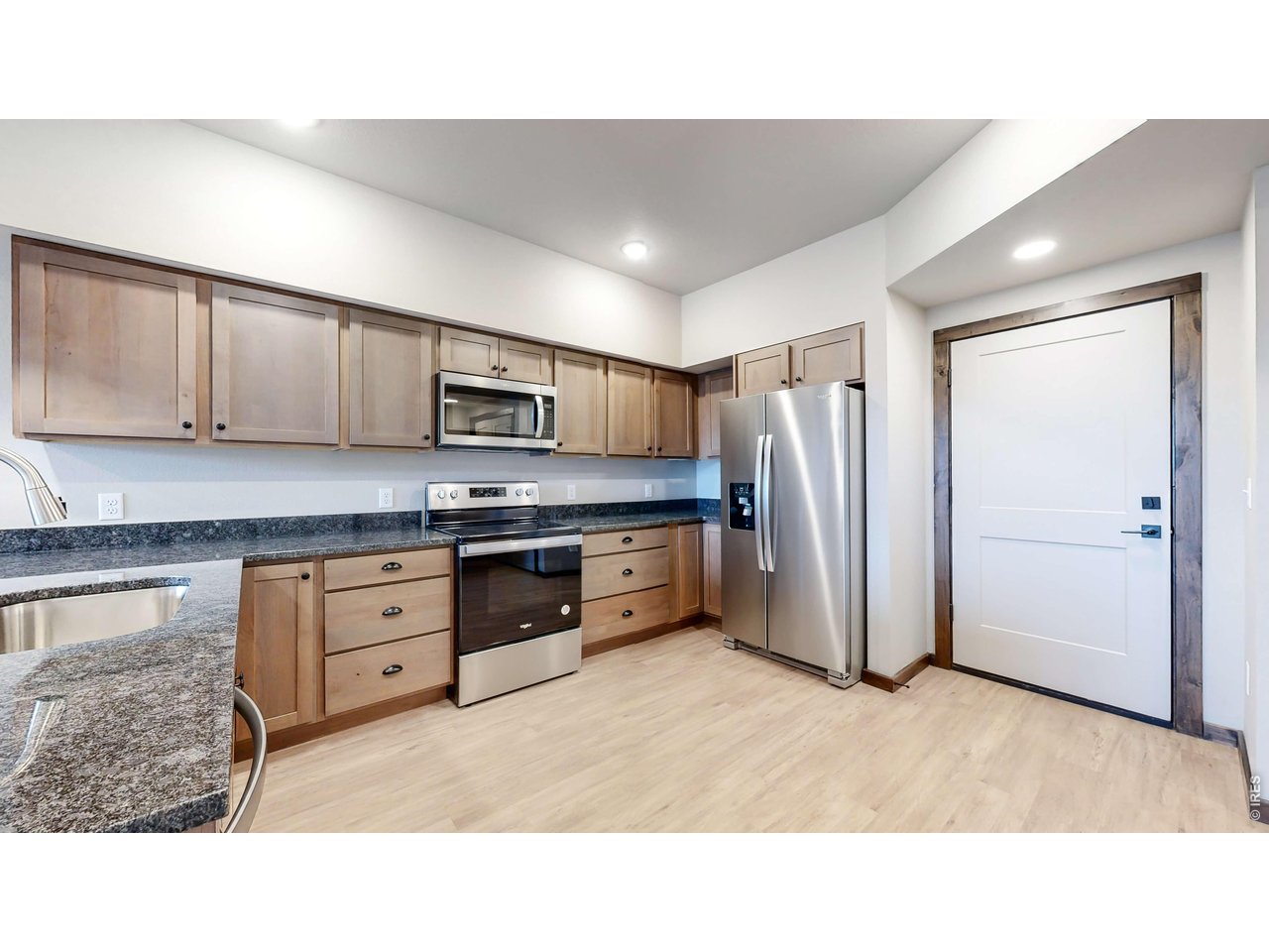 1734 Wildfire Road, Unit 204 Estes Park, CO 80517 - Photo 14 of 31 a kitchen with appliances cabinets and a sink