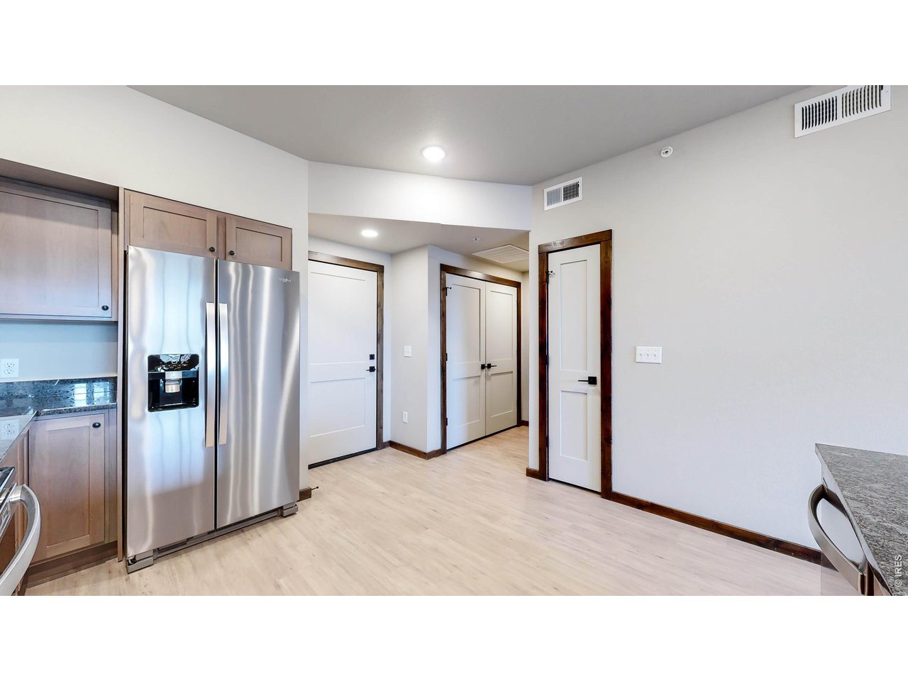 1734 Wildfire Road, Unit 204 Estes Park, CO 80517 - Photo 15 of 31 a open hall with a refrigerator