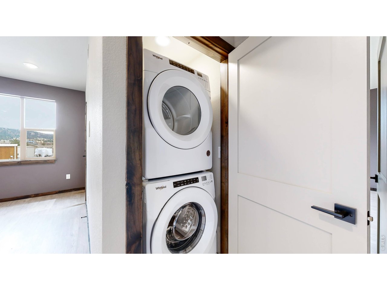 1734 Wildfire Road, Unit 204 Estes Park, CO 80517 - Photo 16 of 31 a hallway with a washer and dryer