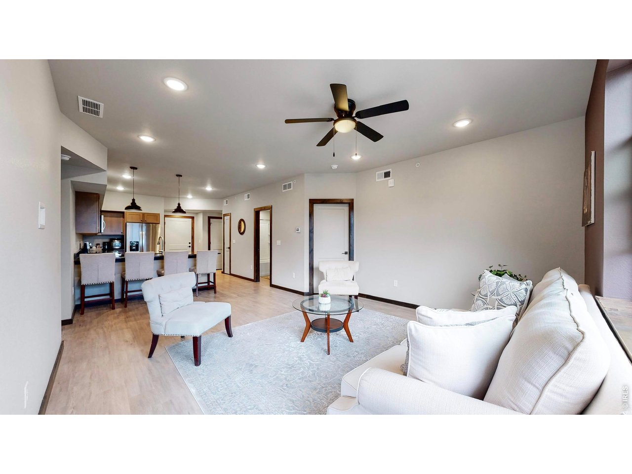 1734 Wildfire Road, Unit 204 Estes Park, CO 80517 - Photo 17 of 31 a living room with furniture and a ceiling fan