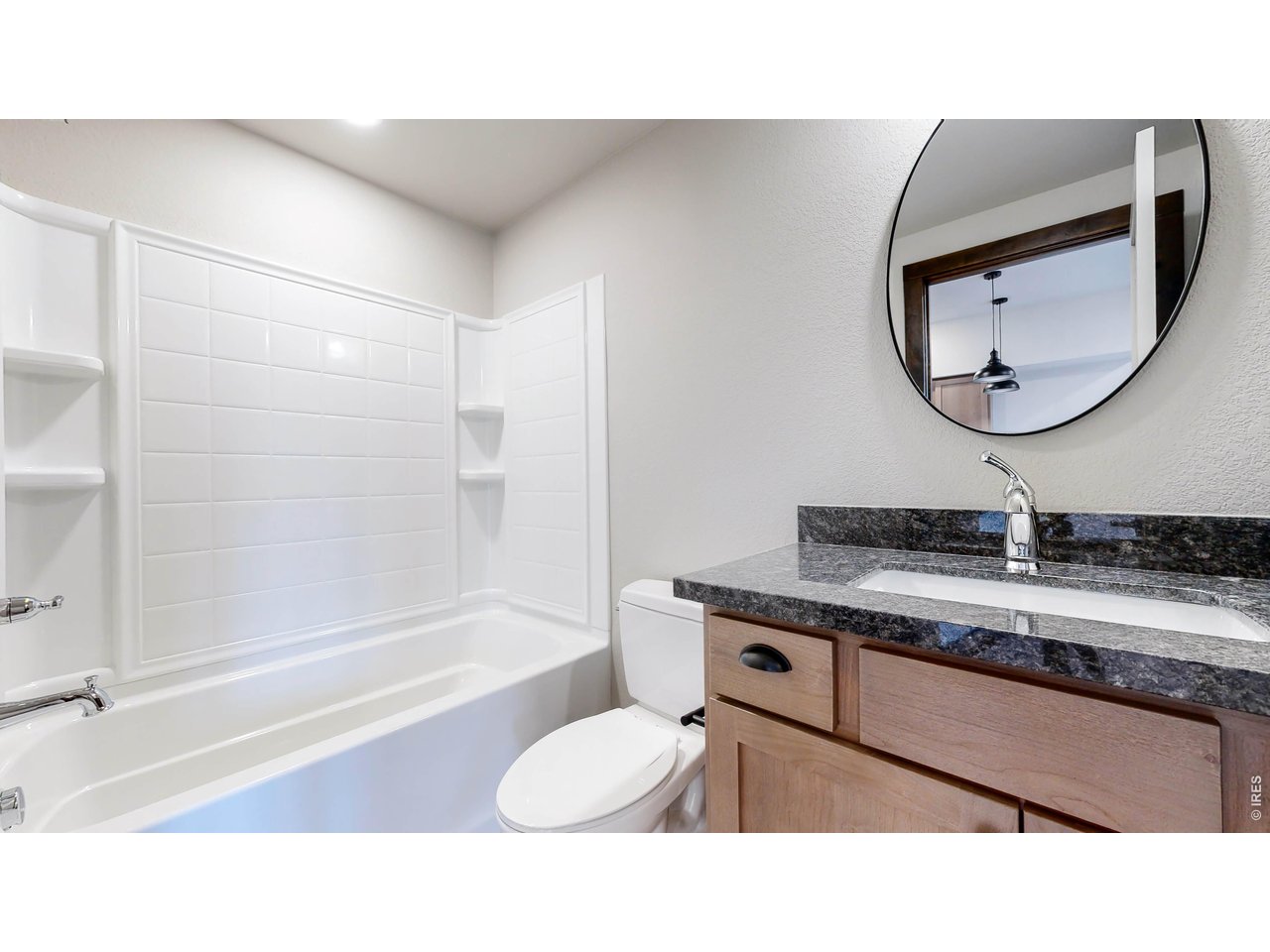 1734 Wildfire Road, Unit 204 Estes Park, CO 80517 - Photo 21 of 31 a bathroom with a sink a toilet and a mirror