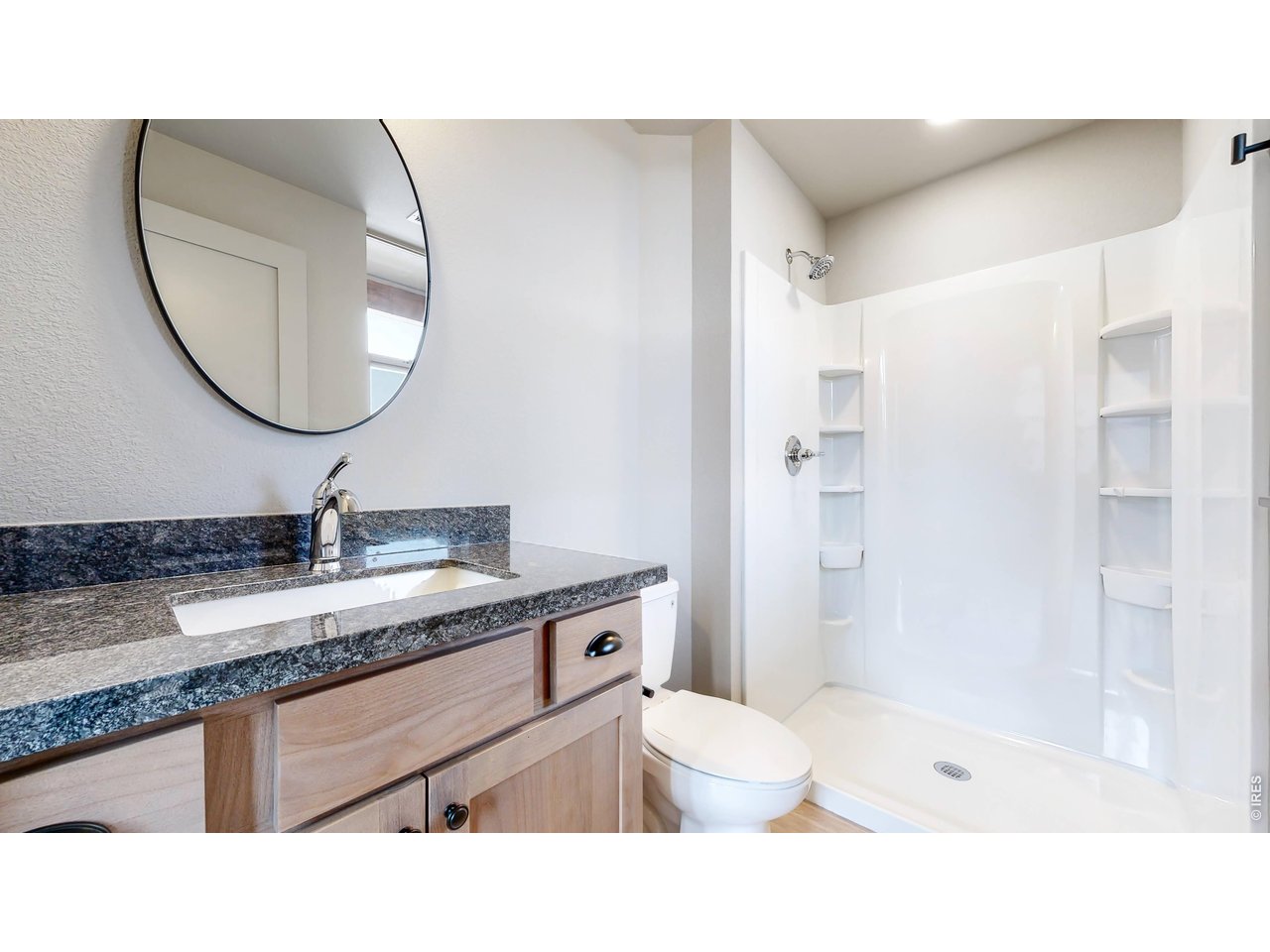 1734 Wildfire Road, Unit 204 Estes Park, CO 80517 - Photo 22 of 31 a bathroom with a sink a toilet and a mirror
