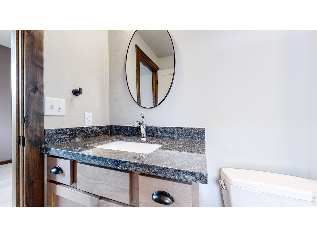 1734 Wildfire Road, Unit 204 Estes Park, CO 80517 - Photo 24 of 31 a bathroom with a sink and a mirror