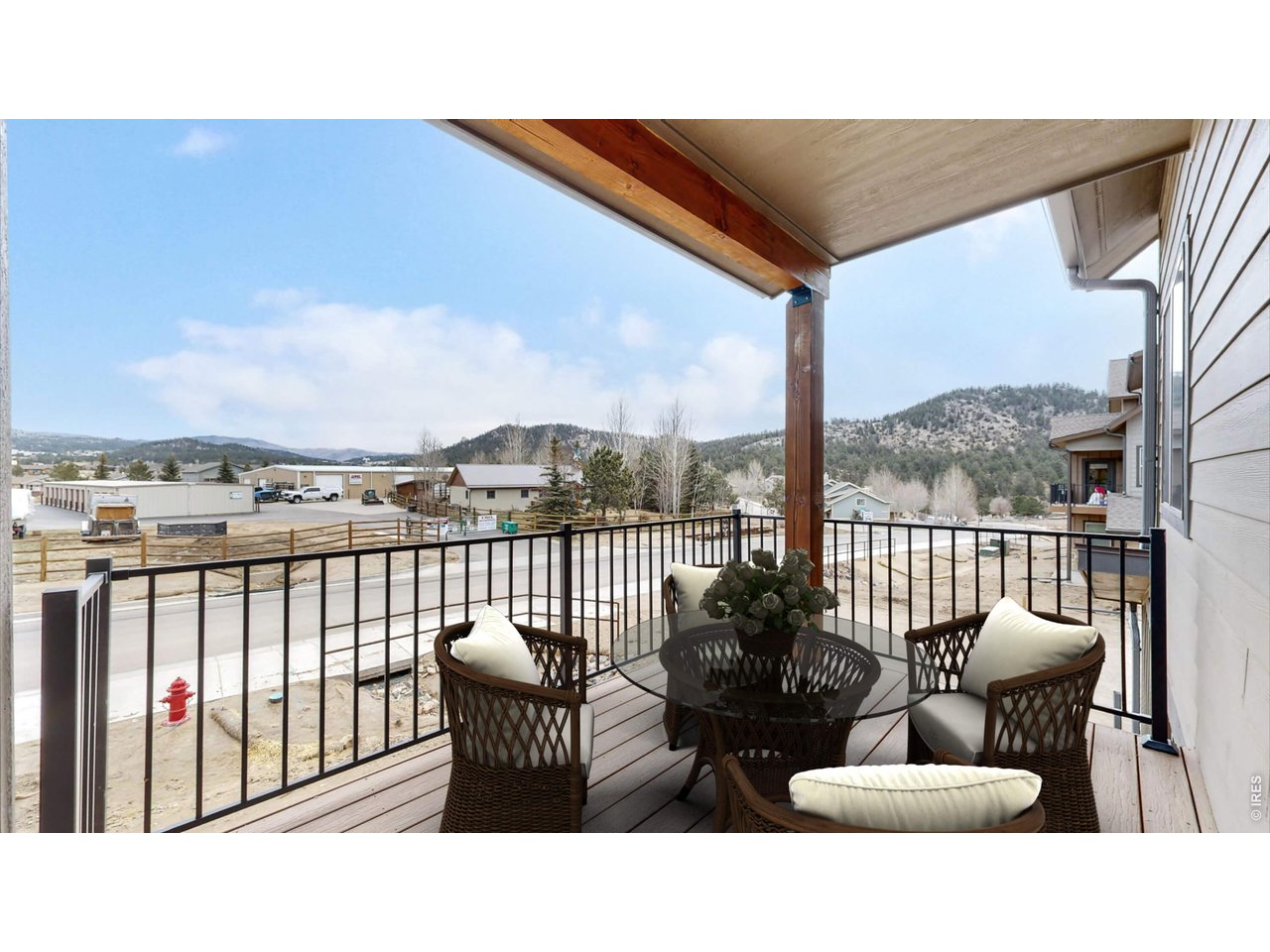1734 Wildfire Road, Unit 204 Estes Park, CO 80517 - Photo 6 of 31 a balcony with furniture and city view