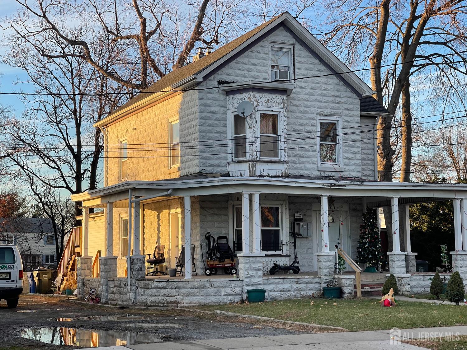 577 Rahway Avenue Woodbridge, NJ 07095 - Photo 6 of 6 a front view of a house with swimming pool